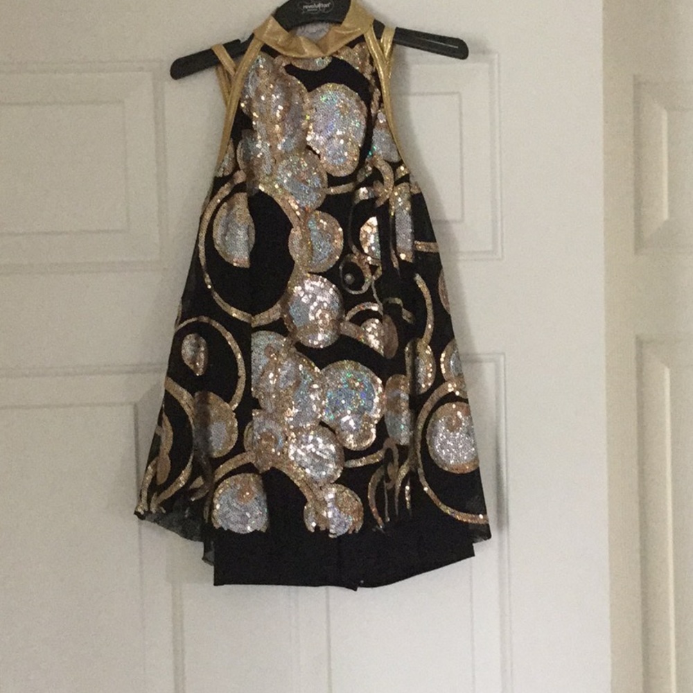 Black and gold sequined dance costume